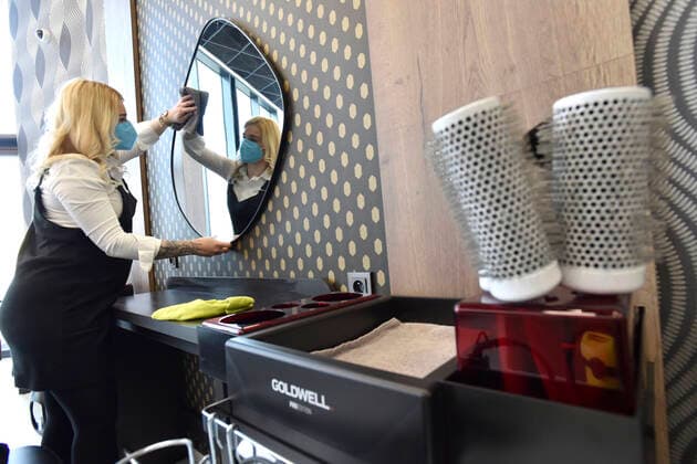 A hairdresser Kristyna Humlova prepares her salon in the Futurum shopping mall in Brno, for reopening as further coronavirus lockdown restrictions are lifted in Czech Republic. Hairdressers, cosmetics, massage, animal care and similar services can reopen in Czechia as of May 3 amid the improving coronavirus epidemic situation. (CTKxPhoto VaclavxSalek) CTKPhotoP2021043007188  sal 09