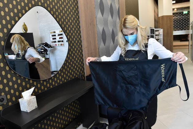 A hairdresser Kristyna Humlova prepares her salon in the Futurum shopping mall in Brno, for reopening as further coronavirus lockdown restrictions are lifted in Czech Republic. Hairdressers, cosmetics, massage, animal care and similar services can reopen in Czechia as of May 3 amid the improving coronavirus epidemic situation. (CTKxPhoto VaclavxSalek) CTKPhotoP2021043007240  sal 06