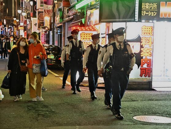 Members of Tokyo Metropolitan Police Department patrol at Kabukicho shopping and entertainment district in Tokyo, Japan on Friday, April 30, 2021. Tokyo Metropolitan Government asks for pedestrians to don t drink alcohol on the street.  TKP2021043023 KEIZOxMORI