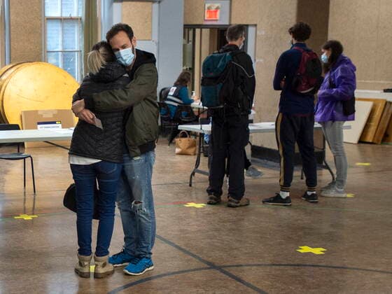 April 30, 2021, Montreal, PQ, Canada: A couple hug as they wait for their COVID-19 vaccination at a mobile clinic for members of First Nations and their partners, in Montreal, Friday, April 30, 2021. Montreal Canada  - ZUMAc35_ 20210430_zaf_c35_019 Copyright: xRyanxRemiorzx