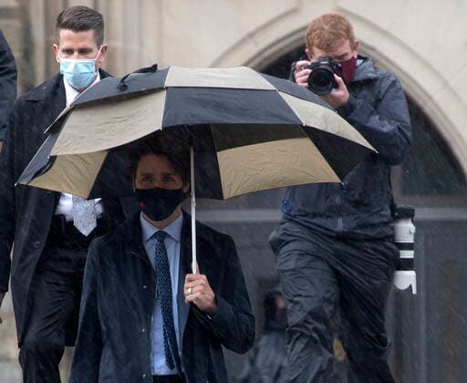 April 30, 2021, Ottawa, on, Canada: The prime ministers photographer Adam Scotti follows Prime Minister Justin Trudeau as he walks to a news conference in Ottawa, Friday April 30, 2021. Ottawa Canada  - ZUMAc35_ 20210430_zaf_c35_041 Copyright: xAdrianxWyldx