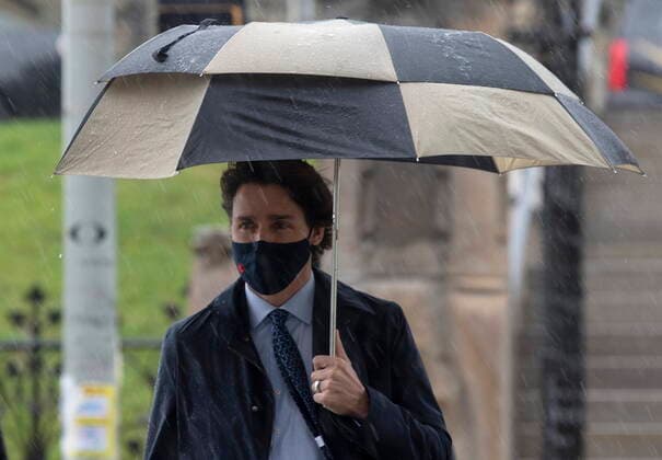 April 30, 2021, Ottawa, on, Canada: Prime Minister Justin Trudeau walks to a news conference in the Parliamentary precinct on a rainy day in Ottawa, Friday, April 30, 2021. Ottawa Canada  - ZUMAc35_ 20210430_zaf_c35_047 Copyright: xAdrianxWyldx