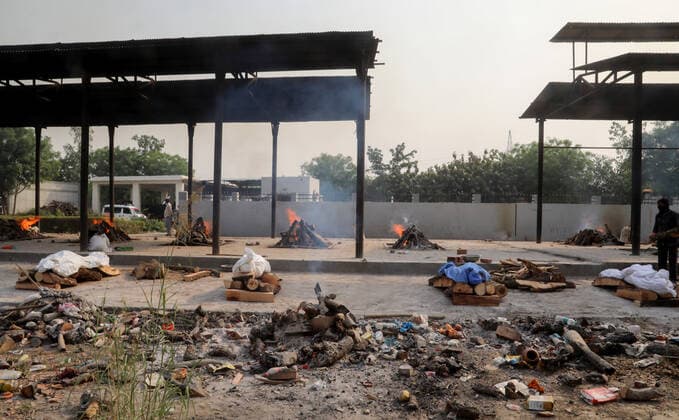 April 30, 2021, New Delhi, India: (EDITORS NOTE: Image depicts death).Bodies of those who lost their life due to the coronavirus Covid-19 disease wait to be cremated during the mass cremation at Dwarka crematorium..The ongoing vaccination drive will open for 18-45 age group from May 01, 2021. India has recorded 386,452 new coronavirus infection cases and 3,498 death in the last 24 hours. New Delhi India - ZUMAs197 20210430_zaa_s197_078 Copyright: xNaveenxSharmax