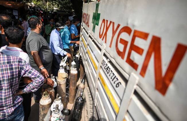 NEW DELHI, INDIA - APRIL 30: A rush of people waiting to refill empty oxygen cylinders, at Bhogal Jangpura, on April 30, 2021 in New Delhi, India. (Photo by Amal KS Hindustan Times) India Faces Oxygen Crisis As Covid-19 Cases Mount