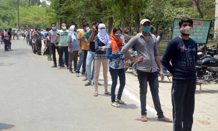 May 1, 2021, Prayagraj, Uttar Pradesh, India: Prayagraj: People in queue to get first dose of COVID19 vaccine at Moti Lal Neharu Medical college in Prayagraj on Saturday, May 01, 2021 Prayagraj India - ZUMAv115 20210501_zap_v115_040 Copyright: xPrabhatxKumarxVermax