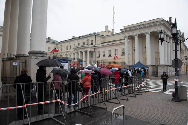 May 1, 2021, Warsaw, Warsaw, Poland: People form a queue in front of the Warsaw City Hall to get their vaccine against Covid-19 on May 1, 2021 in Warsaw, Poland. People which are 30 years and older and have been previously registered to get their vaccine can get their shot without appointment from May 1 to May 3 in sixteen Polish cities in mobile vaccination spots. In the mobile vaccination spots Johnson & Johnson vaccine is administered. Warsaw Poland - ZUMAk156 20210501_zip_k156_006 Copyright: xAleksanderxKalkax