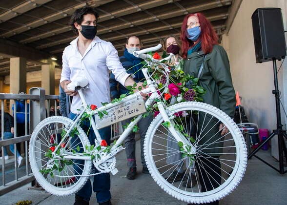 May 2, 2021, Montreal, PQ, Canada: Karim Kammah, left, of Velo Fantome, hands a white bicycle to Genevieve Laborde, mother of Mathilde Blais, during a ceremony in Montreal, Sunday, May 2, 2021. Blais was killed at this spot in 2014 and the bike has been donated to the Museum of Civilization in Quebec City. Montreal Canada - ZUMAc35_ 20210502_zaf_c35_008 Copyright: xGrahamxHughesx