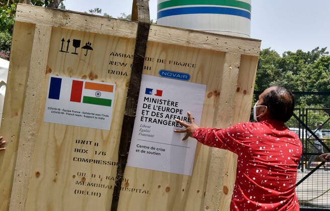 NEW DELHI, INDIA - MAY 2: Oxygen generator and a High-Pressure filling system donated by the Govt. of France to BLK-Max Hospital, being unloaded, on May 2, 2021 in New Delhi, India. (Photo by Sanjeev Verma Hindustan Times ) Daily Life Amid Coronavirus Pandemic In India