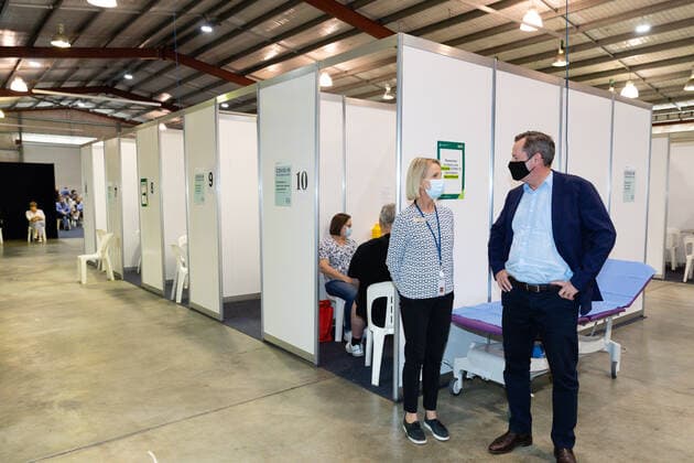 MARK MCGOWAN COVID19 VACCINATION, WA Premier Mark McGowan is seen talking with nurse Tracey Morris in a mass vaccination centre at Claremont Showgrounds in Perth, Monday, May 2, 2021. From today over-50s are eligible for the Covid-19 immunisation program at two mass public vaccination clinics in Perth. ( NO ARCHIVING, EDITORIAL USE ONLY, NO USE IN BOOKS WITHOUT CONSENT PERTH WA AUSTRALIA  Copyright: xRICHARDxWAINWRIGHTx 20210503001539404164