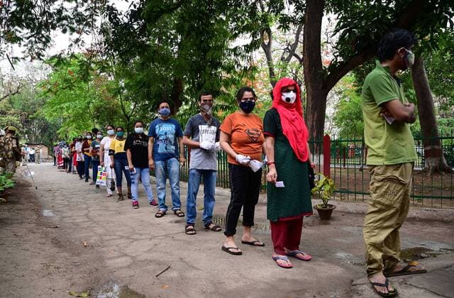 May 3, 2021, Prayagraj, Uttar Pradesh, India: Prayagraj: Youth wait in a queue to take first dose of the Covaxin coronavirus vaccine, at Moti Lal Nehru Medical College in Allahabad on May, 2021 during India s vaccination drive to all adults. Prayagraj India - ZUMAv115 20210503_zap_v115_011 Copyright: xPrabhatxKumarxVermax
