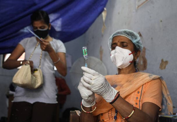 May 3, 2021, New Delhi, India: A healthcare worker prepares a dose of coronavirus (Covid-19) vaccine at a government school turned into vaccination center in Delhi..In last 24 hours, India recorded 368,147 fresh covid-19 cases and 3,405 deaths. New Delhi India - ZUMAs197 20210503_zaa_s197_035 Copyright: xNaveenxSharmax