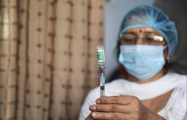 May 3, 2021, New Delhi, India: A healthcare worker prepares a dose of coronavirus (Covid-19) vaccine at a government school turned into vaccination center in Delhi..In last 24 hours, India recorded 368,147 fresh covid-19 cases and 3,405 deaths. New Delhi India - ZUMAs197 20210503_zaa_s197_055 Copyright: xNaveenxSharmax