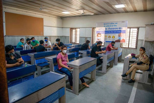 May 3, 2021, New Delhi, India: People wait in an observation room after being vaccinated at the Sarvoday Kanya Vidyalay West Vinod Nagar where a temporary vaccination centre has been converted..Third phase of Covid-19 Mass Vaccination Drive for People above 18 begins in Delhi capital of India. According to Delhi Deputy Chief Minister Manish Sisodia. 301 Vaccination centres set-up in 76 schools across Delhi, Vaccinating Today 45,100 Delhi Citizens, Next few days 3000 Vaccination centres will start operating in 300 schools across Delhi. New Delhi India - ZUMAs197 20210503_zaa_s197_031 Copyright: xPradeepxGaurx