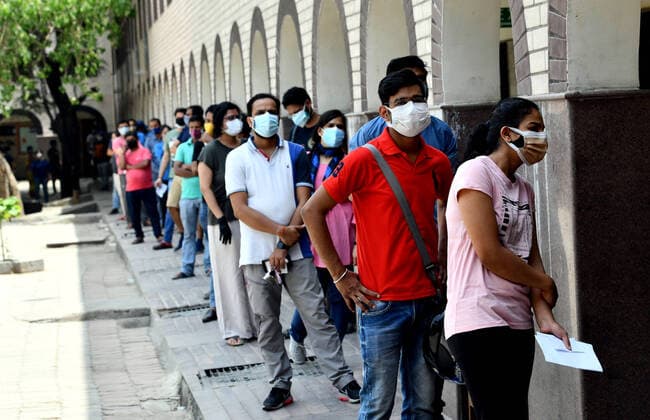 (210503) -- NEW DELHI, May 3, 2021 (Xinhua) -- People wait to receive COVID-19 vaccination at a government school in Delhi, India, on May 3, 2021. (Xinhua ) NEW DELHI Copyright: xParthaxSarkarx