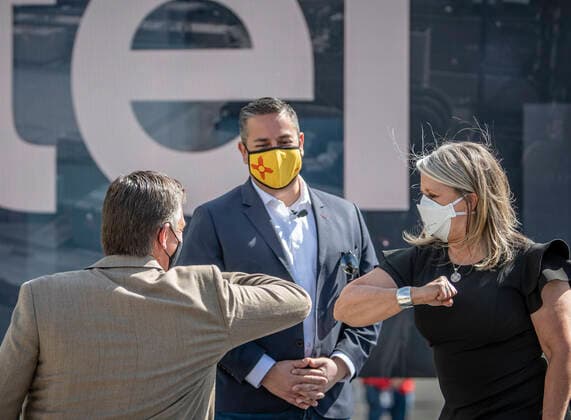 May 2, 2021, Rio Rancho, New Mexico, USA: .Intel plans to invest 3.5 Billion doollars in the Rio Rancho facility. The announcement was made Monday morning at a press conference on the Itel campus off rt 528. Pictured from left to right are: NM Senator Martin Heinrich(Cq) NM Senator Ben Ray Lujan(Cq) and Governor Michelle Lujan Grisham(Cq) greeting each other at the beginning of the event. .Sr. Vice President at Intel..Rio Rancho, New Mexico. Rio Rancho USA - ZUMAab1_ 20210502_zaf_ab1_013 Copyright: xRobertoxE.xRosalesx