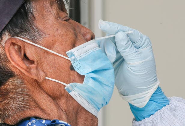 May 4, 2021, Bangkok, Thailand: A health worker collects a nasal swab sample from a man on a biosafety mobile vehicle in Bangkok..Thailand s Covid-19 death toll surpassed 300 on Tuesday, as 27 deaths and 1,763 new cases were added, bringing the toll to 303 fatalities and 72,788 cases. Bangkok Thailand - ZUMAs197 20210504_zaa_s197_037 Copyright: xChaiwatxSubprasomx