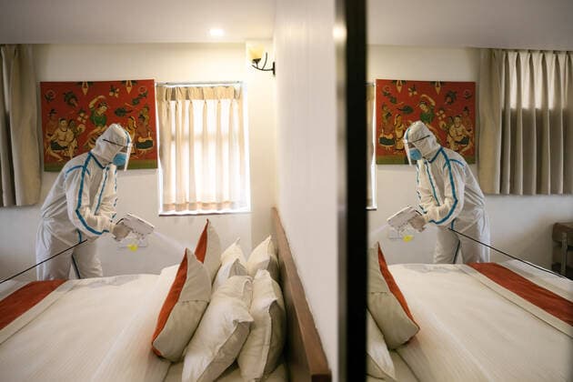 May 4, 2021, Kathmandu, Nepal: An employee wearing a personal protective equipment suite (PPE) uses an Electrostatic Sprayer to disinfect a room inside the Hotel Timber house which has been converted into an isolation center for Covid-19 patients in disadvantaged or vulnerable situations in Kathmandu..Nepal confirmed 7,587 new cases and 55 fatalities of COVID-19 taking the nation s novel coronavirus tally to 351,005. Kathmandu Nepal - ZUMAs197 20210504_zaa_s197_126 Copyright: xPrabinxRanabhatx