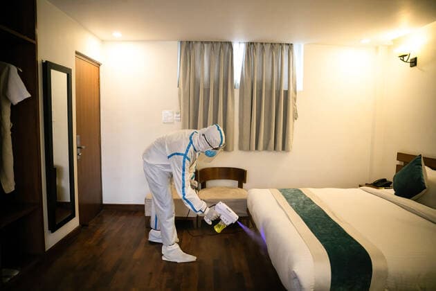 May 4, 2021, Kathmandu, Nepal: An employee wearing a personal protective equipment suite (PPE) uses an Electrostatic Sprayer to disinfect a room inside the Hotel Timber house which has been converted into an isolation center for Covid-19 patients in disadvantaged or vulnerable situations in Kathmandu. Nepal confirmed 7,587 new cases and 55 fatalities of COVID-19 taking the nation s novel coronavirus tally to 351,005. Kathmandu Nepal - ZUMAs197 20210504_zaa_s197_124 Copyright: xPrabinxRanabhatx