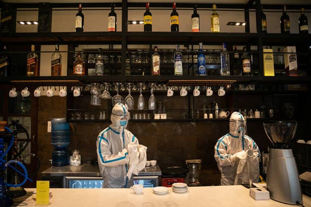 May 4, 2021, Kathmandu, Nepal: An employees wearing Personal protective equipment (PPE) cleaning restaurant bar surfaces at Hotel Timber house which has been converted into an isolation center for Covid-19 patients in disadvantaged or vulnerable situations in Kathmandu. Nepal confirmed 7,587 new cases and 55 fatalities of COVID-19 taking the nation s novel coronavirus tally to 351,005. Kathmandu Nepal - ZUMAs197 20210504_zaa_s197_125 Copyright: xPrabinxRanabhatx