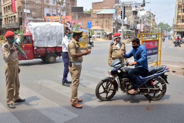 May 5, 2021, Prayagraj, Uttar Pradesh, India: Prayagraj: Police stop people during government imposed lockdown in wake of Corona virus spread in Prayagraj on Wednesday, May 05, 2021. Prayagraj India - ZUMAv115 20210505_zap_v115_002 Copyright: xPrabhatxKumarxVermax