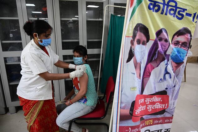 May 5, 2021, Prayagraj, Uttar Pradesh, India: Prayagraj: A medical worker inoculates a girl with a dose of Covaxin vaccine against the Covid-19 coronavirus at Moti Lal Nehru Medical College in Prayagraj on Wednesday, May 05, 2021. Prayagraj India - ZUMAv115 20210505_zap_v115_019 Copyright: xPrabhatxKumarxVermax