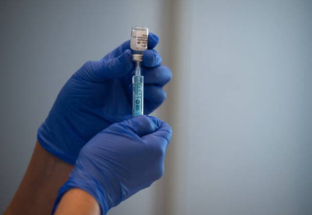May 5, 2021, Malaga, Spain: A health worker seen preparing a dose of Pfizer vaccine in a syringe during a massive vaccination at Fair and Congresses Palace..Health regional authorities have retimed again the vaccination with doses of Pfizer BioNTech inside large and secure places following all protective measures, as part of massive vaccination One million plan after the announcement of Andalusian government to inoculate around 600.000 vaccines during the week. Malaga Spain - ZUMAs197 20210505_zaa_s197_017 Copyright: xJesusxMeridax