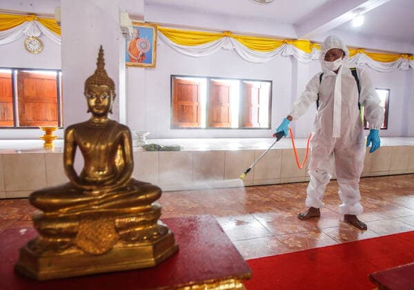 May 5, 2021, Nonthaburi, Thailand: A Buddhist monk wearing personal protective equipment suites (PPE) sprays disinfectant at the crematorium before a cremation rite of a free cremation funeral for a COVID-19 victim with monks in attendance of the ceremony at Wat Bang Muang, in Nonthaburi province. .The government on Wednesday reported 15 new Covid-19 deaths, bringing the toll to 318, and 2,112 new cases, raising the total to 74,900. Nonthaburi Thailand - ZUMAs197 20210505_zaa_s197_079 Copyright: xChaiwatxSubprasomx