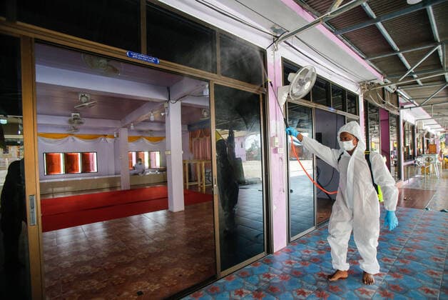 May 5, 2021, Nonthaburi, Thailand: A Buddhist monk wearing personal protective equipment suites (PPE) sprays disinfectant at the crematorium before a cremation rite of a free cremation funeral for a COVID-19 victim with monks in attendance of the ceremony at Wat Bang Muang, in Nonthaburi province. .The government on Wednesday reported 15 new Covid-19 deaths, bringing the toll to 318, and 2,112 new cases, raising the total to 74,900. Nonthaburi Thailand - ZUMAs197 20210505_zaa_s197_081 Copyright: xChaiwatxSubprasomx