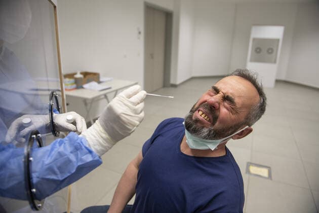 A medical worker collects a swab from a man for a COVID-19 test in Ankara, Turkey, on May 5, 2021. Turkey has confirmed 41,883 deaths and 4,955,594 positive cases of the coronavirus infection in the country. ( Copyright: AbdurrahmanxAntakyalix-xDepoxPho 17129906