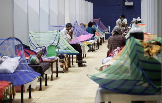 May 5, 2021, New Delhi, India: Covid-19 infected patients seen inside a Covid care center of the Commonwealth Games (CWG) villages temporarily converted into a Covid-19 care facility..In India people experience oxygen shortage in hospitals, and long queues outside the oxygen refilling center during the second wave of the Covid-19 pandemic. New Delhi India - ZUMAs197 20210505_zaa_s197_132 Copyright: xNaveenxSharmax
