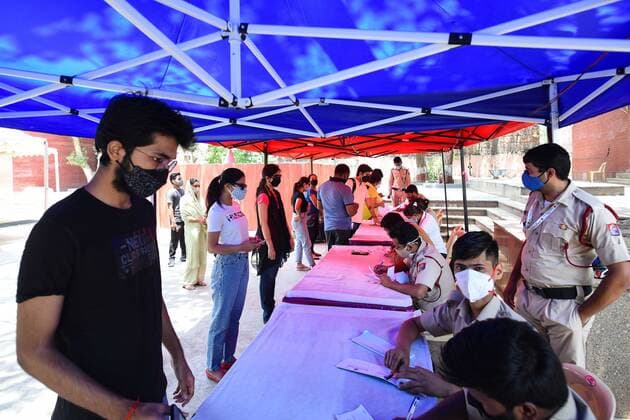 NEW DELHI, INDIA - MAY 5: People queue during the third phase of vaccination at Girls senior secondary school, Chhatarpur on May 5, 2021 in New Delhi, India. (Photo by Amal KS Hindustan Times) COVID-19 Vaccination Drive