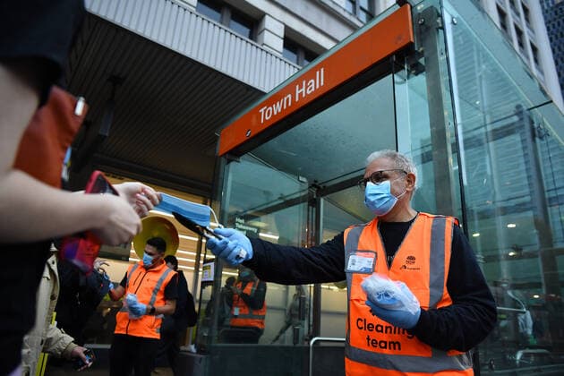 NSW CORONAVIRUS COVID19, NSW Transport workers hand out face masks at Town Hall rail station in Sydney, Thursday, May 6, 2021. In Sydney, the Blue Mountains, the Central Coast and Illawarra, masks will be compulsory at all public indoor venues and on public transport from 5pm on Thursday while visitors in homes will be capped at 20. ( NO ARCHIVING, EDITORIAL USE ONLY, NO USE IN BOOKS WITHOUT CONSENT SYDNEY NSW AUSTRALIA  Copyright: xJOELxCARRETTx 20210506001540057649