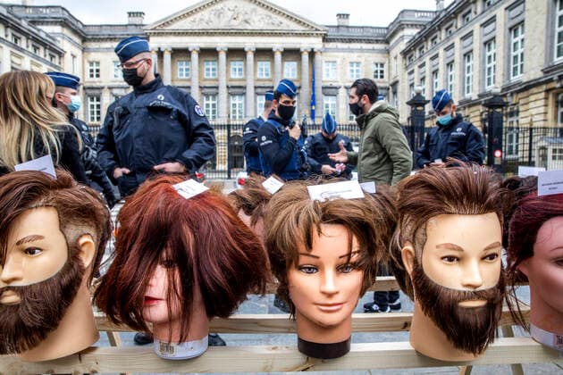 Police intervene at a hairdressers protest outside a plenary session of the chamber at the federal parliament in Brussels, Thursday 06 May 2021.  HATIMxKAGHAT 2711911