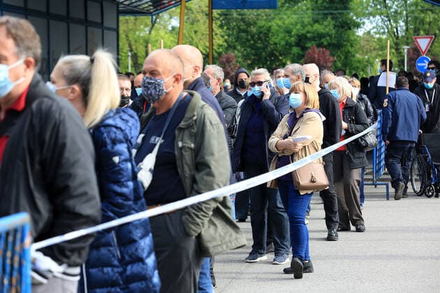 Tourism workers vaccination Tourism workes line up to get shots of vaccines against the coronavirus disease (COVID-19) during mass vaccination of tourism workers at Zagrebacki Velesajam hall in Zagreb, Croatia on May 6, 2021. About 70,000 people from the tourism sector will get opportunity to be vaccinated in next few weeks all over Croatia to try save tourist season. MarinxTironi PIXSELL