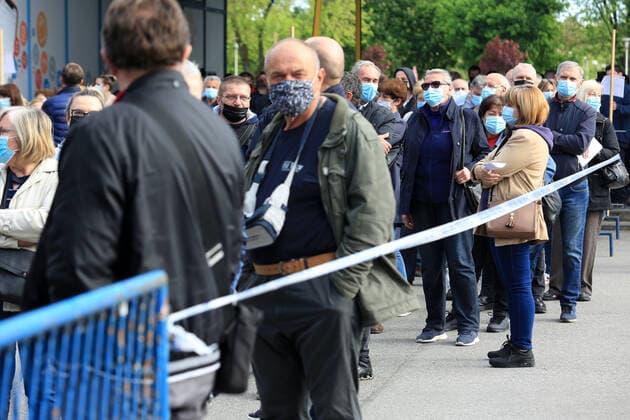 Tourism workers vaccination Tourism workes line up to get shots of vaccines against the coronavirus disease (COVID-19) during mass vaccination of tourism workers at Zagrebacki Velesajam hall in Zagreb, Croatia on May 6, 2021. About 70,000 people from the tourism sector will get opportunity to be vaccinated in next few weeks all over Croatia to try save tourist season. MarinxTironi PIXSELL