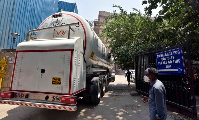 NEW DELHI, INDIA - MAY 6: An oxygen tanker arrives to replenish stocks at the LNJP Hospital, on May 6, 2021 in New Delhi, India. (Photo by Sanjeev Verma Hindustan Times) India Faces Oxygen Crisis As Covid-19 Cases Mount