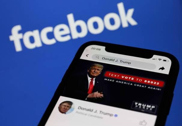 Donald Trump s Facebook Account Donald Trump s Facebook account is seen displayed on a phone screen with Facebook logo in the background in this illustration photo taken in Krakow, Poland on May 6, 2021 Krakow Poland porzycki-donaldtr210506_npjfi  Copyright: xJakubxPorzyckix