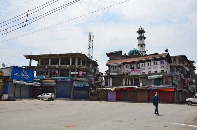 May 7, 2021, Srinagar, India: A man wears a face mask as he walks through a deserted road during a lockdown imposed by the authorities following the surge in coronavirus cases in Srinagar..Normal life remained affected in Jammu and Kashmir on the ninth day of the last Friday of Ramadan with the imposition of lockdown following an alarming surge in coronavirus cases. India reported a record daily rise in coronavirus cases of 414,188, while deaths from COVID-19 swelled by 3,915 in the last 24 hours. Srinagar India - ZUMAs197 20210507_zaa_s197_014 Copyright: xSaqibxMajeedx