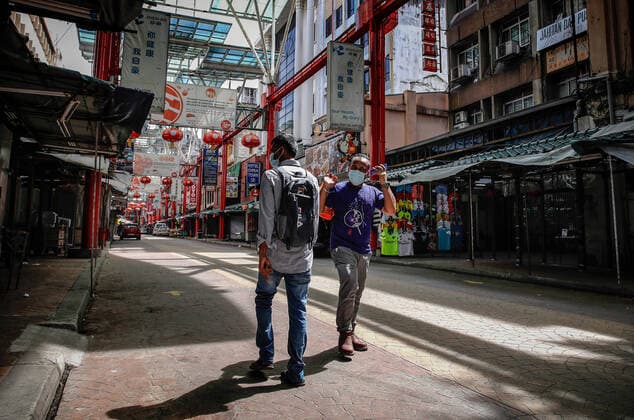 May 7, 2021, Kuala Lumpur, Malaysia: People wearing face masks walk on an empty street in Kuala Lumpur..The federal territory of Kuala Lumpur, the capital city of Malaysia is placed under the movement control order (MCO) from May 7 to May 20, 2021 due to the rise in daily cases of Covid-19 infection. Kuala Lumpur Malaysia - ZUMAs197 20210507_zaa_s197_020 Copyright: xWongxFokxLoyx