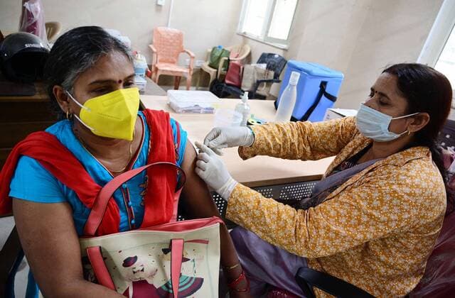 May 8, 2021, Prayagraj, Uttar Pradesh, India: Prayagraj: A medical worker inoculates a women with a dose of Covaxin, vaccine against the Covid-19 coronavirus at Moti Lal Nehru Medical College in Allahabad on Thursday, May 08, 2021. Prayagraj India - ZUMAv115 20210508_zap_v115_003 Copyright: xPrabhatxKumarxVermax
