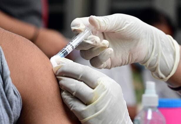 May 8, 2021, Prayagraj, Uttar Pradesh, India: Prayagraj: A medical worker inoculates a youth with a dose of Covaxin, vaccine against the Covid-19 coronavirus at Moti Lal Nehru Medical College in Allahabad on Thursday, May 08, 2021. Prayagraj India - ZUMAv115 20210508_zap_v115_006 Copyright: xPrabhatxKumarxVermax
