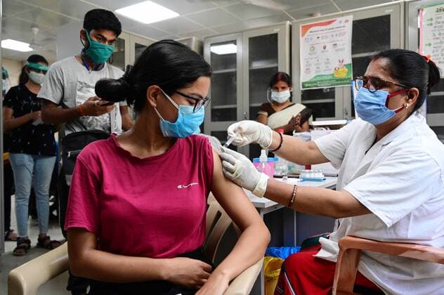 May 8, 2021, Prayagraj, Uttar Pradesh, India: Prayagraj: A medical worker inoculates a youth with a dose of Covaxin, vaccine against the Covid-19 coronavirus at Moti Lal Nehru Medical College in Allahabad on Thursday, May 08, 2021. Prayagraj India - ZUMAv115 20210508_zap_v115_012 Copyright: xPrabhatxKumarxVermax