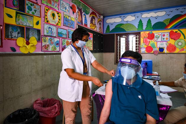 NEW DELHI, INDIA - MAY 8: A person in the age group of 18-44 gets inoculated with a Covid-19 vaccine during the third phase of vaccination, at Ishani Sarvodaya Kanya Vidyalaya school , on May 8, 2021 in New Delhi, India. (Photo by Amal KS Hindustan Times) COVID-19 Vaccination Drive