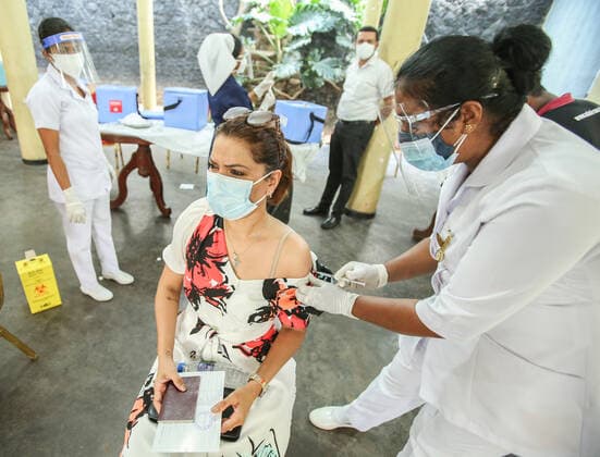 Sri Lanka: First dose of the Chinese-made Sinopharm COVID-19 vaccine A health worker inoculates a woman with a dose of the Chinese-made Sinopharm Covid-19 coronavirus vaccine in Sri Lanka Colombo on May 9, 2021. Colombo Sri Lanka Copyright: SamanxAbesiriwardana