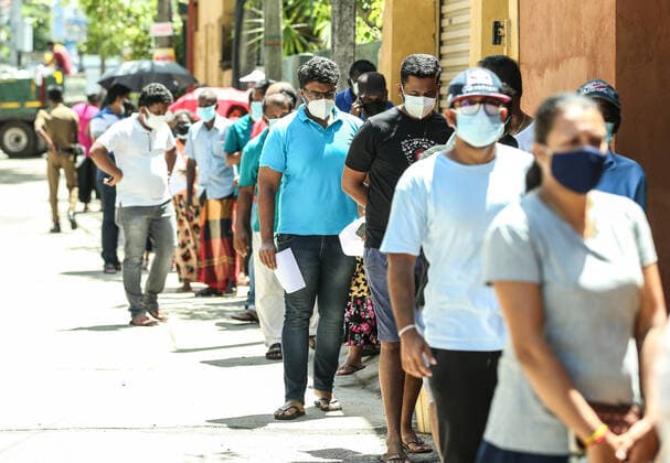 Sri Lanka: First dose of the Chinese-made Sinopharm COVID-19 vaccine People stand in a queue as they wait to get a dose of the Chinese-made Sinopharm Covid-19 coronavirus vaccine in Sri Lanka Colombo on May 9, 2021. Colombo Sri Lanka Copyright: SamanxAbesiriwardana