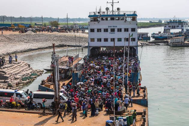Homebound People Gather On A Ferry Without Maintaining The COVID Health Safety In Bangladesh Crowds of people gather on ferry as they travel back home ahead of the Muslim festival Eid al-Fitr at Shimulia ferry ghat in Munshiganj on May 9, 2021. A large number of people living in the south part of Bangladesh travel by ferry without maintaining the COVID health safety this year. Dhaka Bangladesh salahuddinahmed-homeboun210509_npUl0  Copyright: xAhmedxSalahuddinx