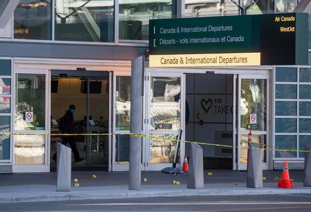 May 9, 2021, Richmond, BC, Canada: Police tape and evidence markers are seen after a one person was killed during a shooting outside the international departures terminal at Vancouver International Airport, in Richmond, B.C., Sunday, May 9, 2021. Richmond Canada  - ZUMAc35_ 20210509_zaf_c35_083 Copyright: xDarrylxDyckx