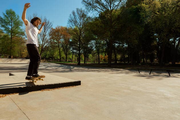 Man riding skateboard in a park Copyright: xAngelaxRoberx Model Released