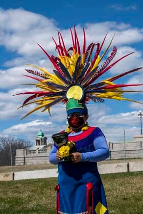 St. Paul, Minnesota. Minnesota State Capitol. Earth day protest. Protesters demand climate justice from the Walz and Biden governments. Portrait of the firekeeper from native dance group Kalpulli KetzalCoatlicue a traditional Aztec dance group holding the insense used in the ceremony at the protest. Â¬ÂMichaelxSilukx xUniversalxImagesxGroup ms_9380.jpg 64393_02_ms_9380