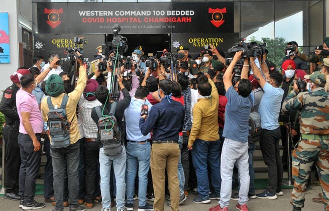 CHANDIGARH, INDIA - MAY 10: Media persons flouting social distancing during the inauguration of a Covid-19 hospital by Governor of Punjab and Administrator UT VP Singh Badnore at International Hostel, South Campus of Panjab University on May 10, 2021 in Chandigarh, India. (Photo by Ravi Kumar Hindustan Times) Army Operationalises 100 Bed Covid Hospital For Civilians In Chandigarh